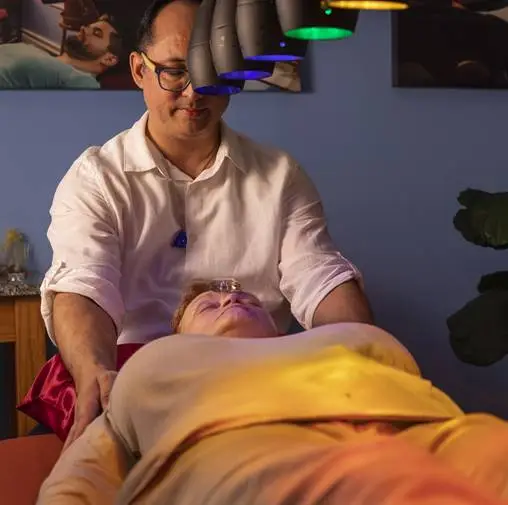 Woman on table getting Reiki